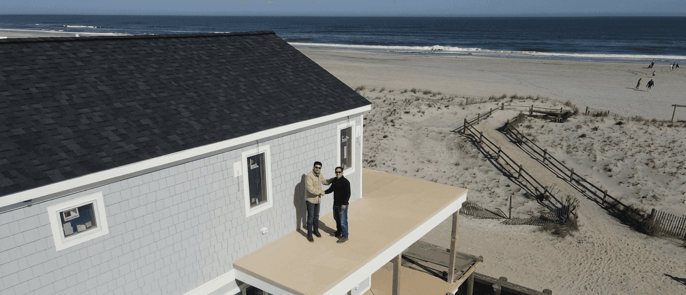 Dan and Vinnie Del Monte together on a shore home under construction